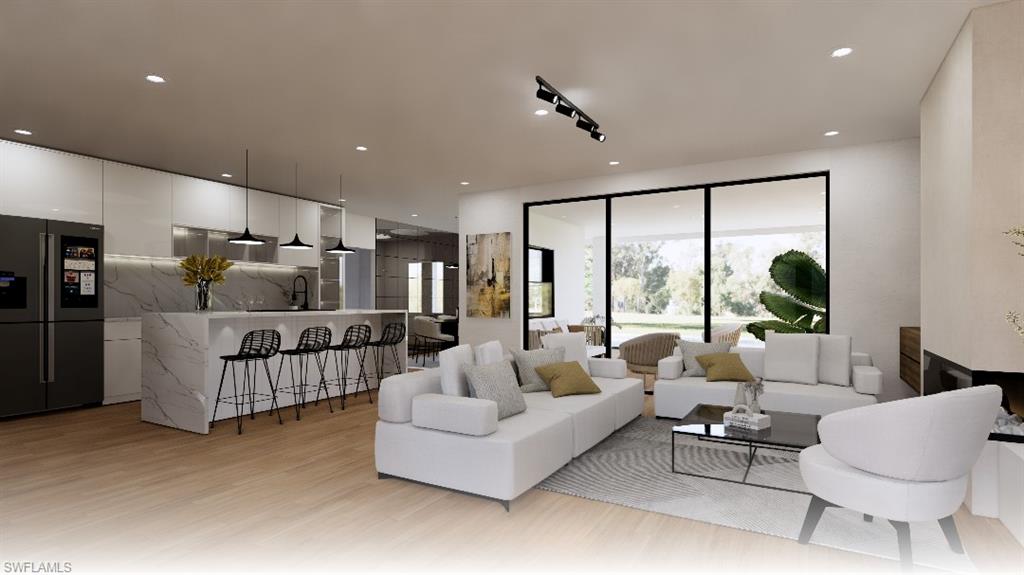 533 6th Street Southeast Naples, FL 34117 - Photo 6 of 9 a living room with furniture and a large window