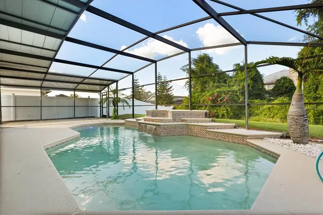 a view of a swimming pool with a patio