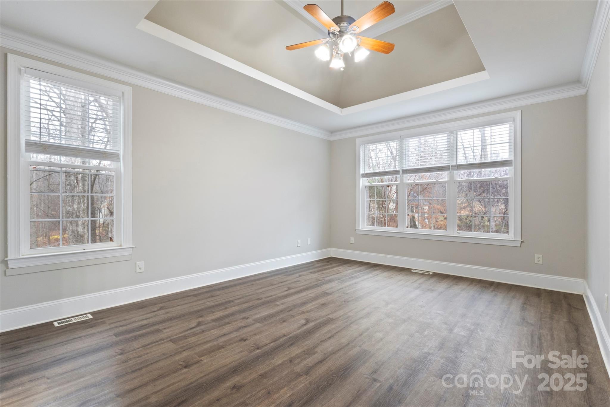 6655 Maple Spring Court Denver, NC 28037 - Photo 16 of 48 a view of an empty room with wooden floor and a window