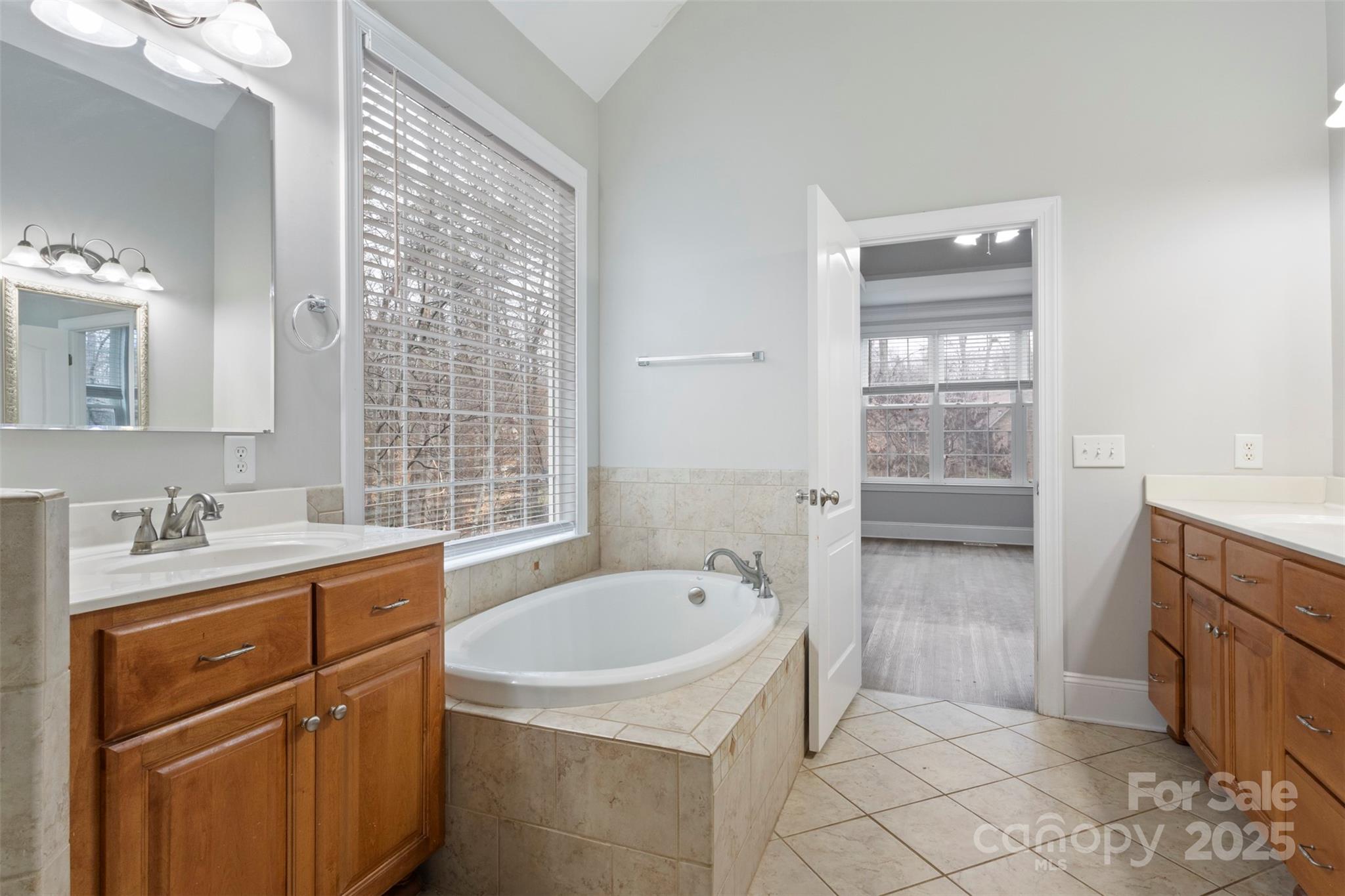 6655 Maple Spring Court Denver, NC 28037 - Photo 17 of 48 a bathroom with a sink a toilet and tub