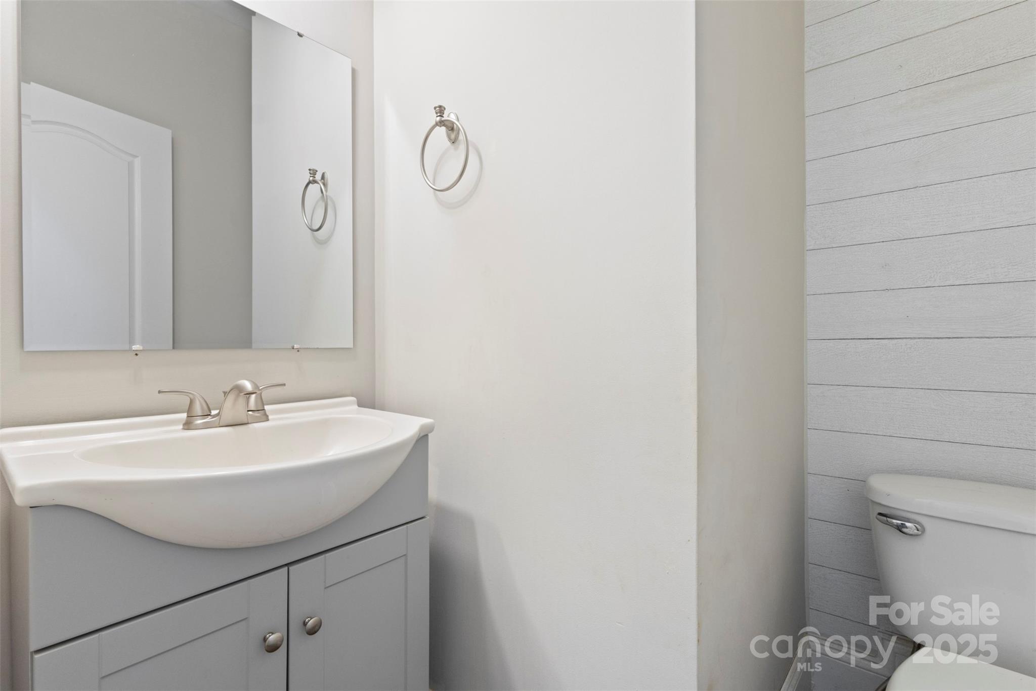 6655 Maple Spring Court Denver, NC 28037 - Photo 19 of 48 a bathroom with a sink a toilet and a mirror