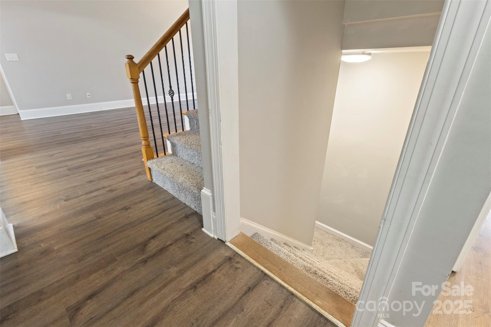 6655 Maple Spring Court Denver, NC 28037 - Photo 26 of 48 a view of a hallway view with wooden floor and staircase