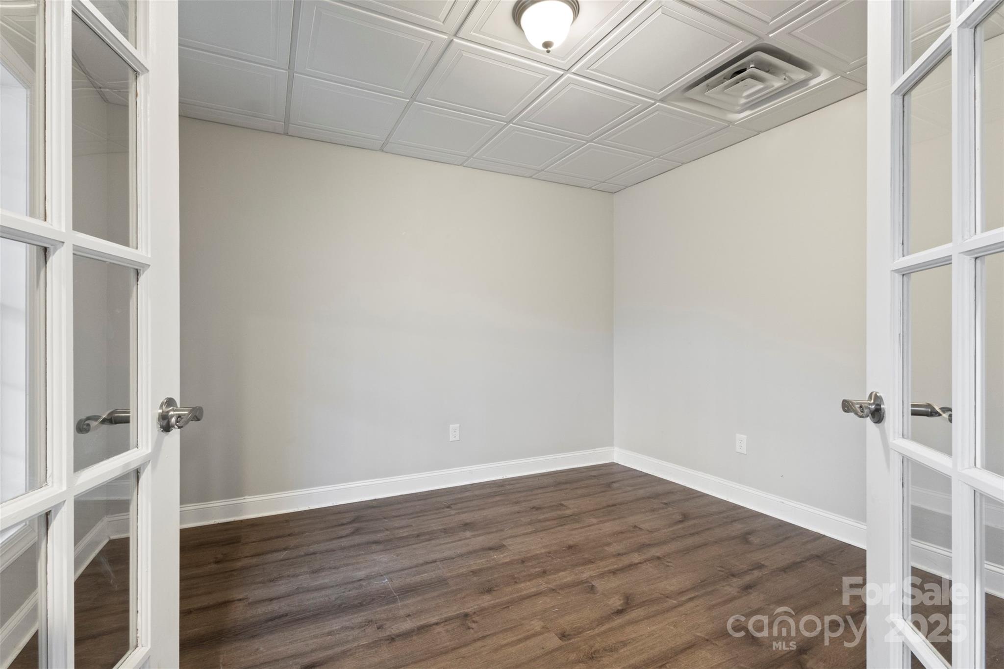 6655 Maple Spring Court Denver, NC 28037 - Photo 31 of 48 a view of an empty room with wooden floor