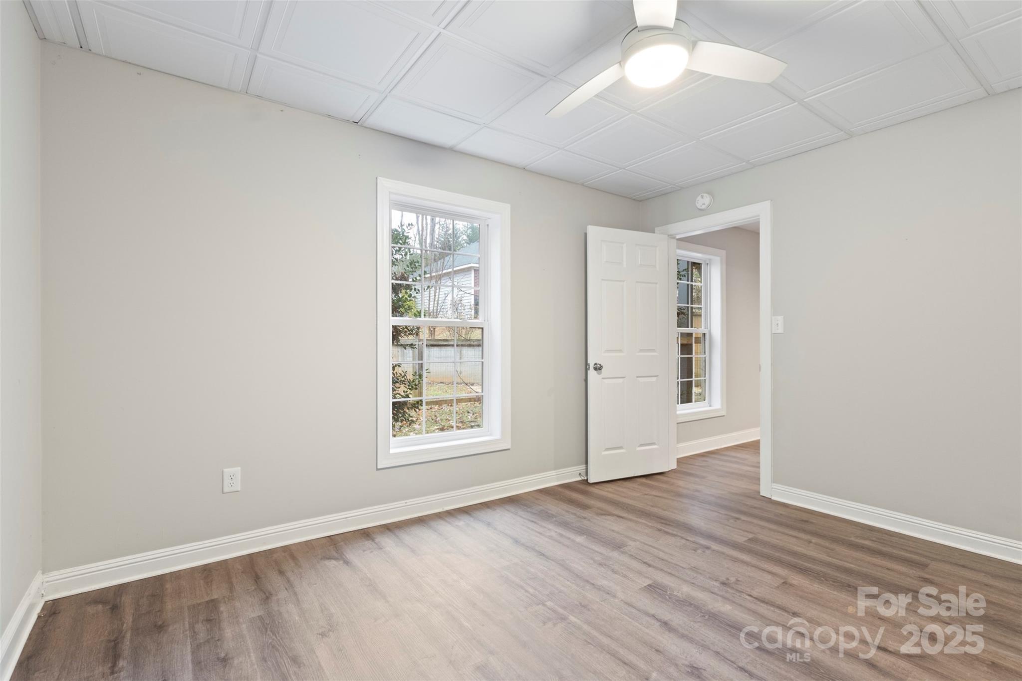 6655 Maple Spring Court Denver, NC 28037 - Photo 33 of 48 an empty room with wooden floor cabinet and windows