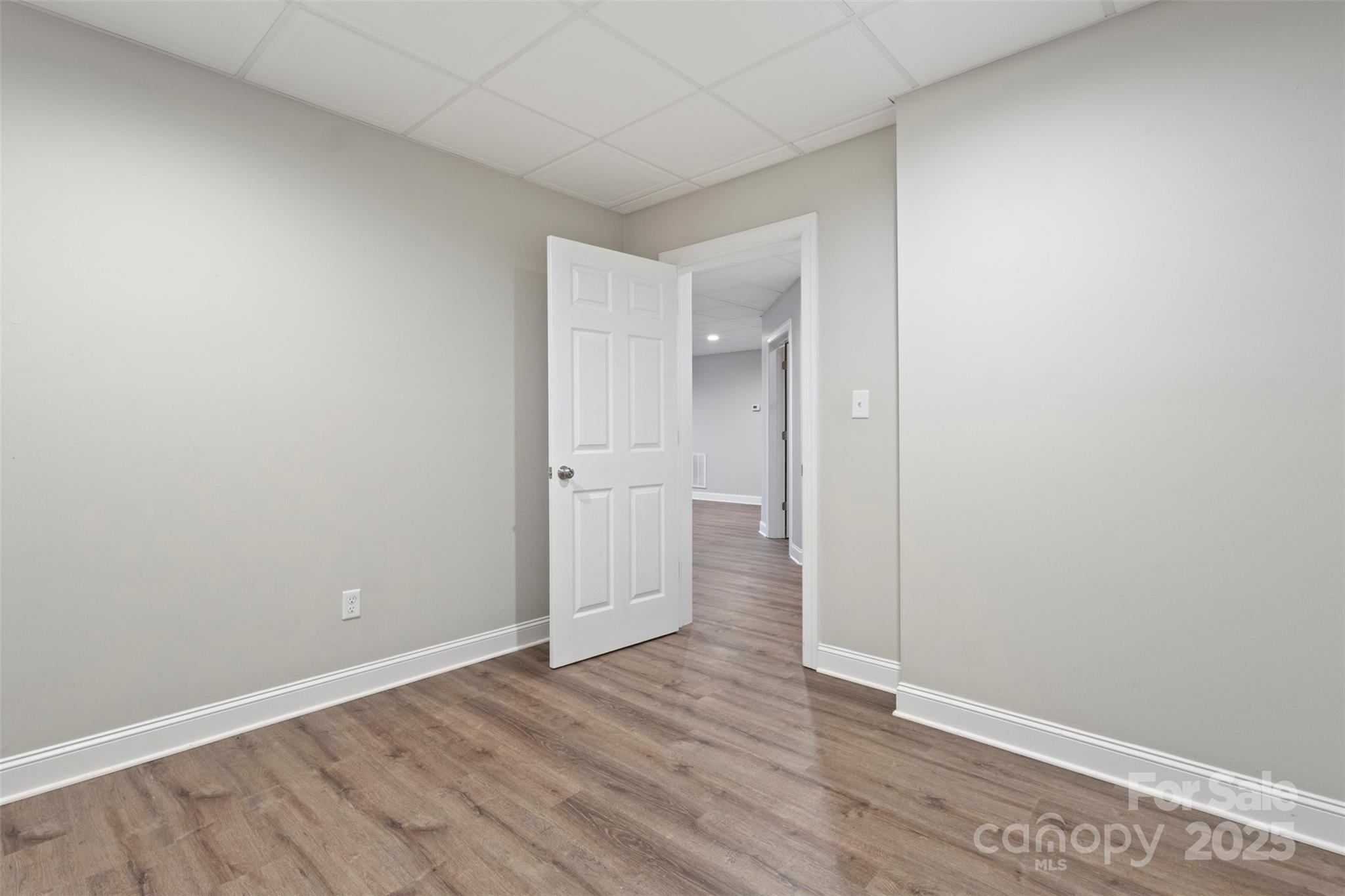 6655 Maple Spring Court Denver, NC 28037 - Photo 34 of 48 a view of an empty room with wooden floor