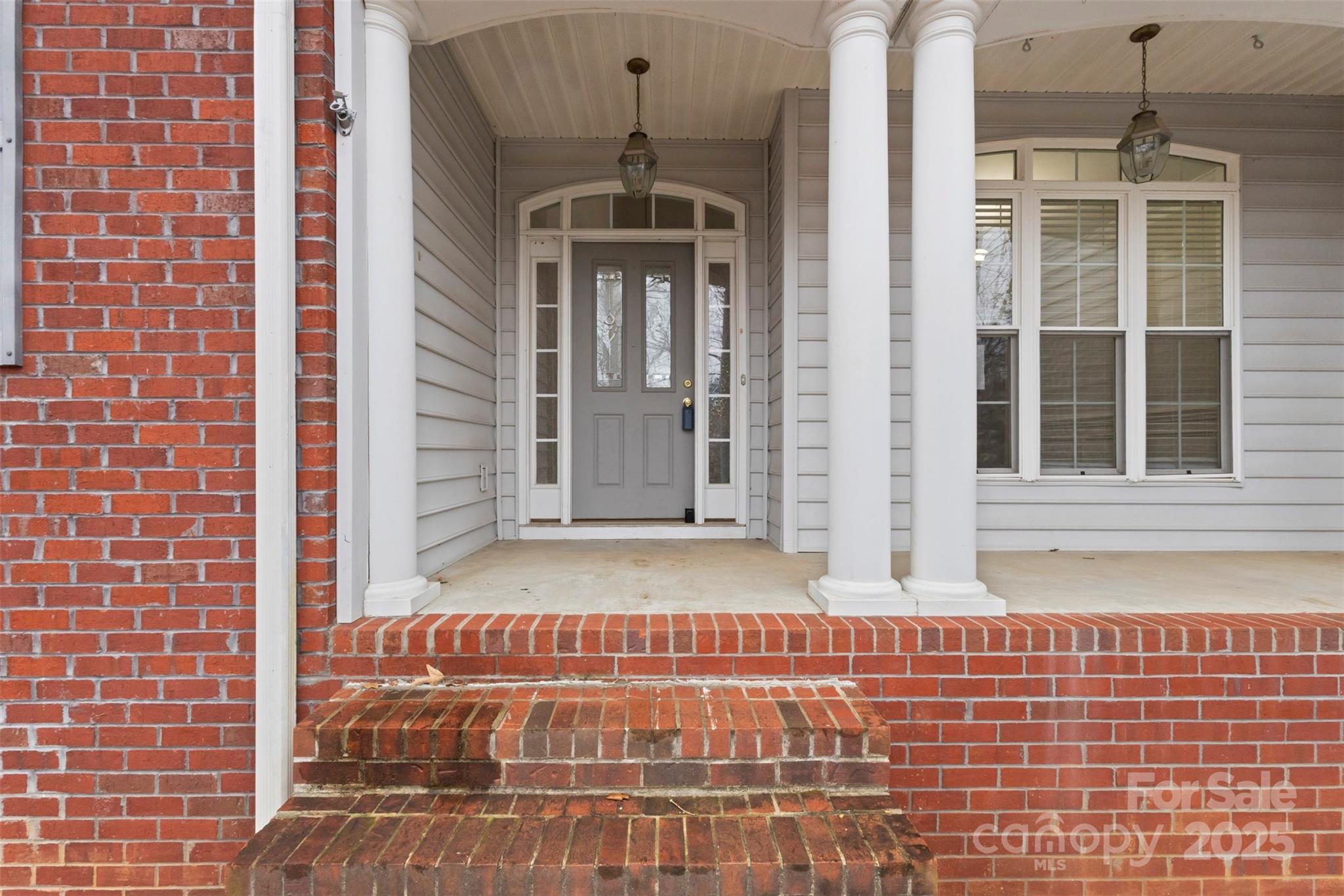 6655 Maple Spring Court Denver, NC 28037 - Photo 6 of 48 a front view of a house with a glass door