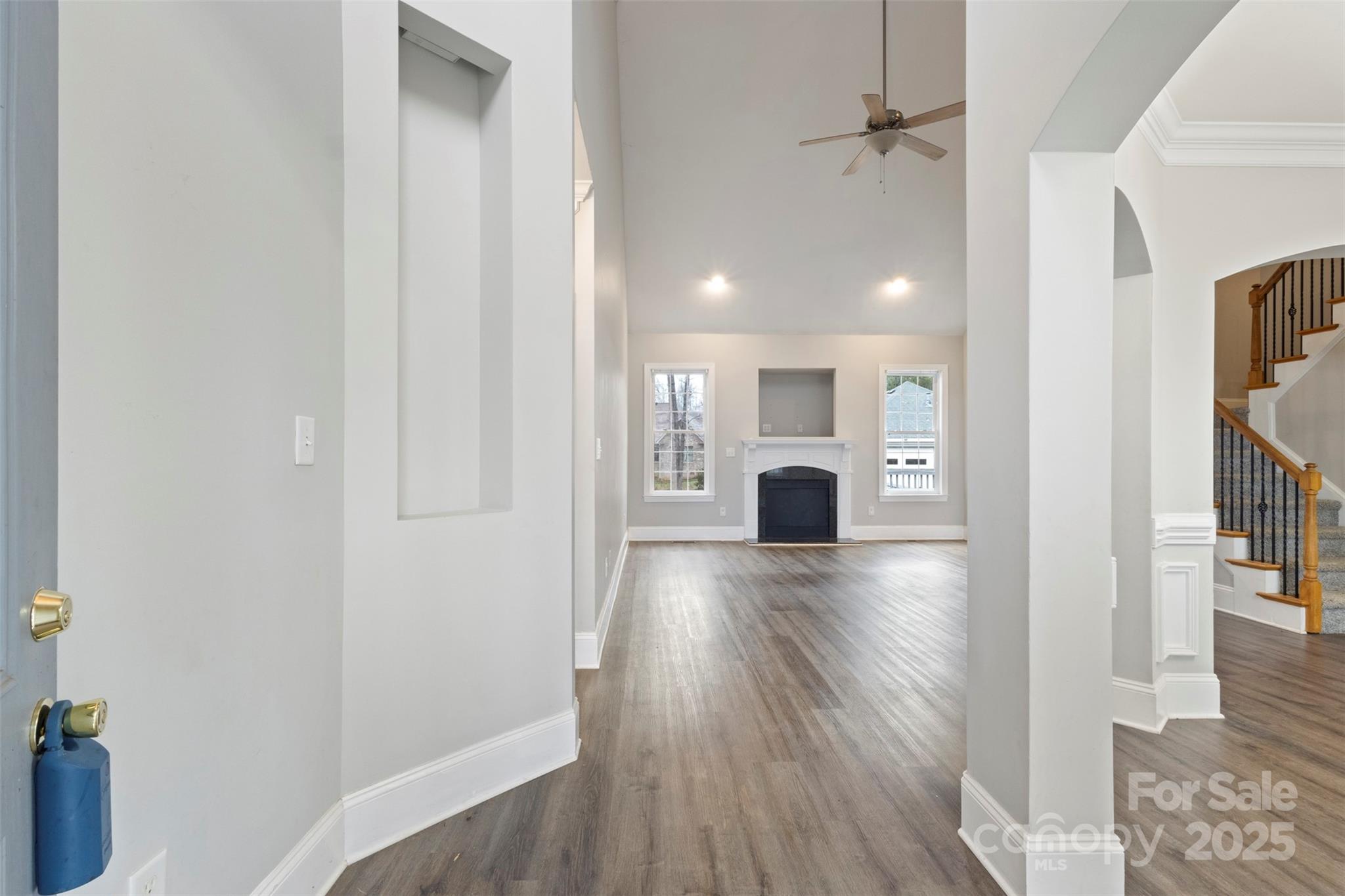 6655 Maple Spring Court Denver, NC 28037 - Photo 7 of 48 a view of a hallway with wooden floor and a living room