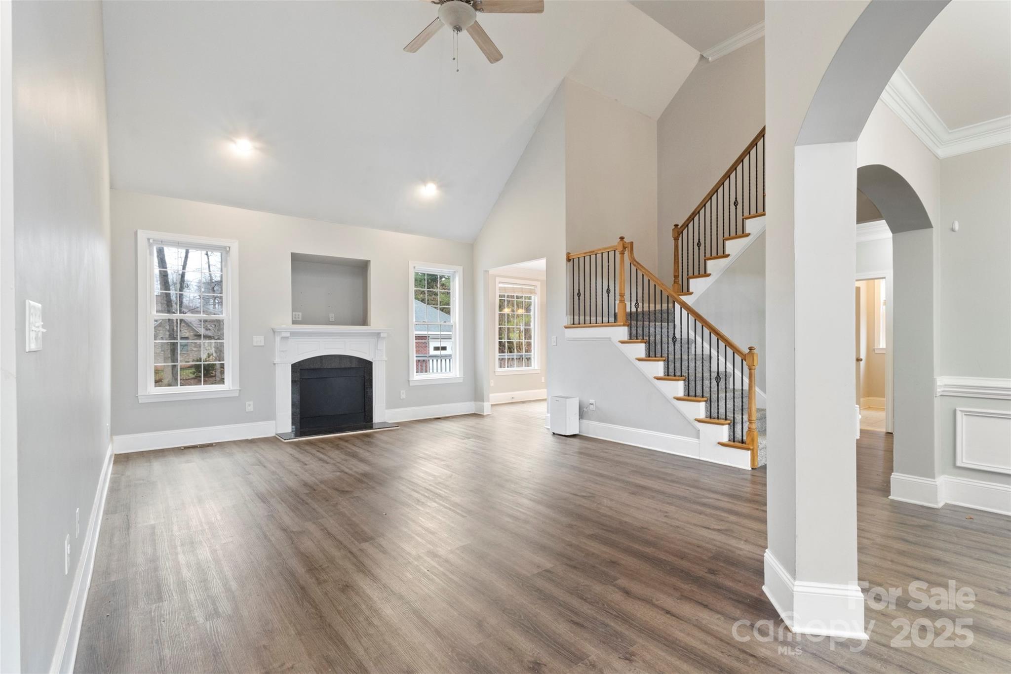 6655 Maple Spring Court Denver, NC 28037 - Photo 8 of 48 a view of empty room with wooden floor and fireplace