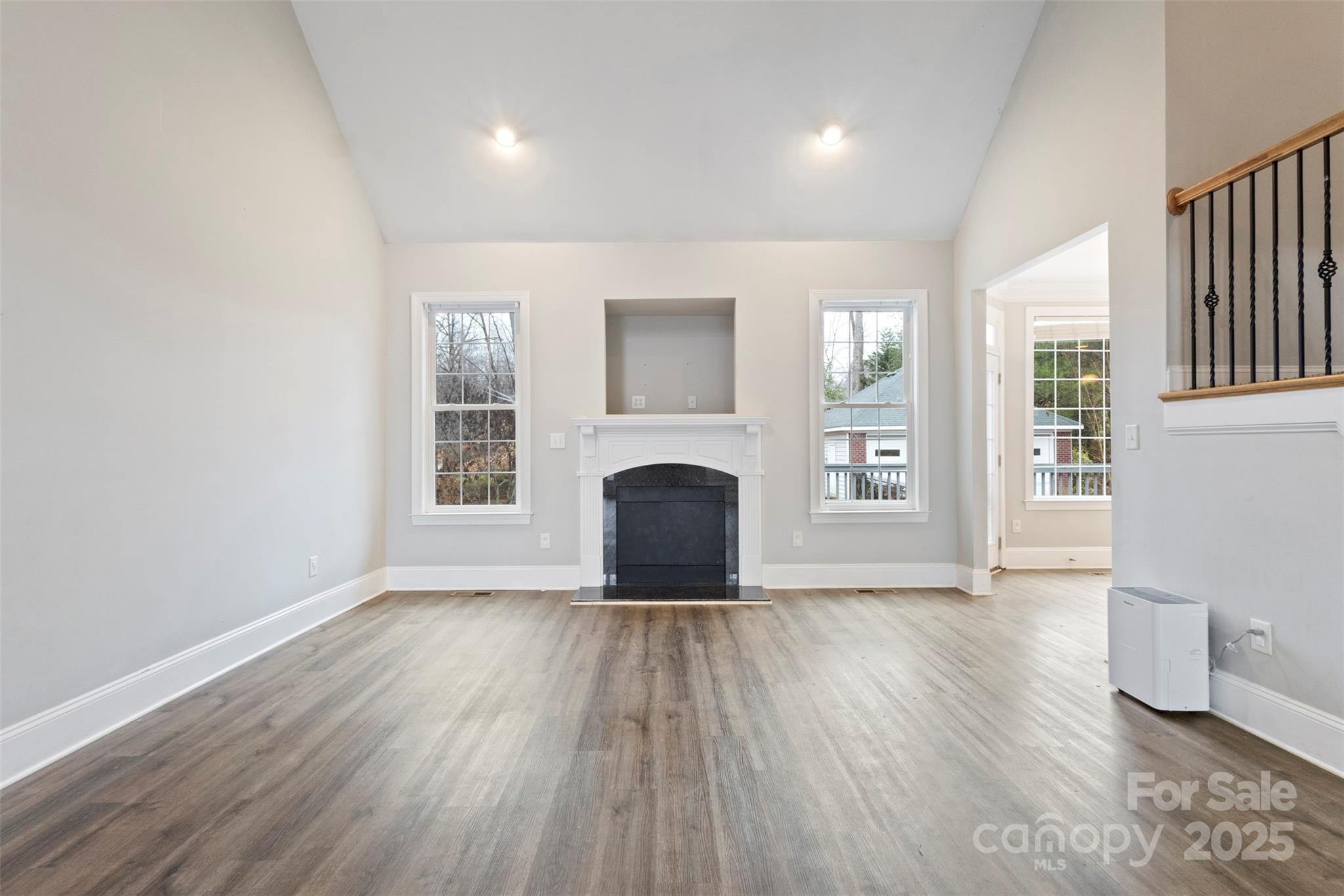 6655 Maple Spring Court Denver, NC 28037 - Photo 9 of 48 a view of a livingroom with wooden floor and a fireplace