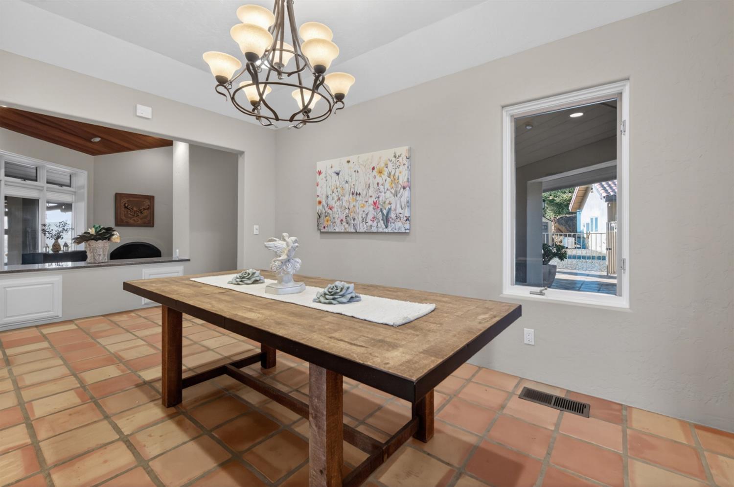 7570 Airola Road Vallecito, CA 95251 - Photo 36 of 90 a view of a dining room with furniture and a chandelier