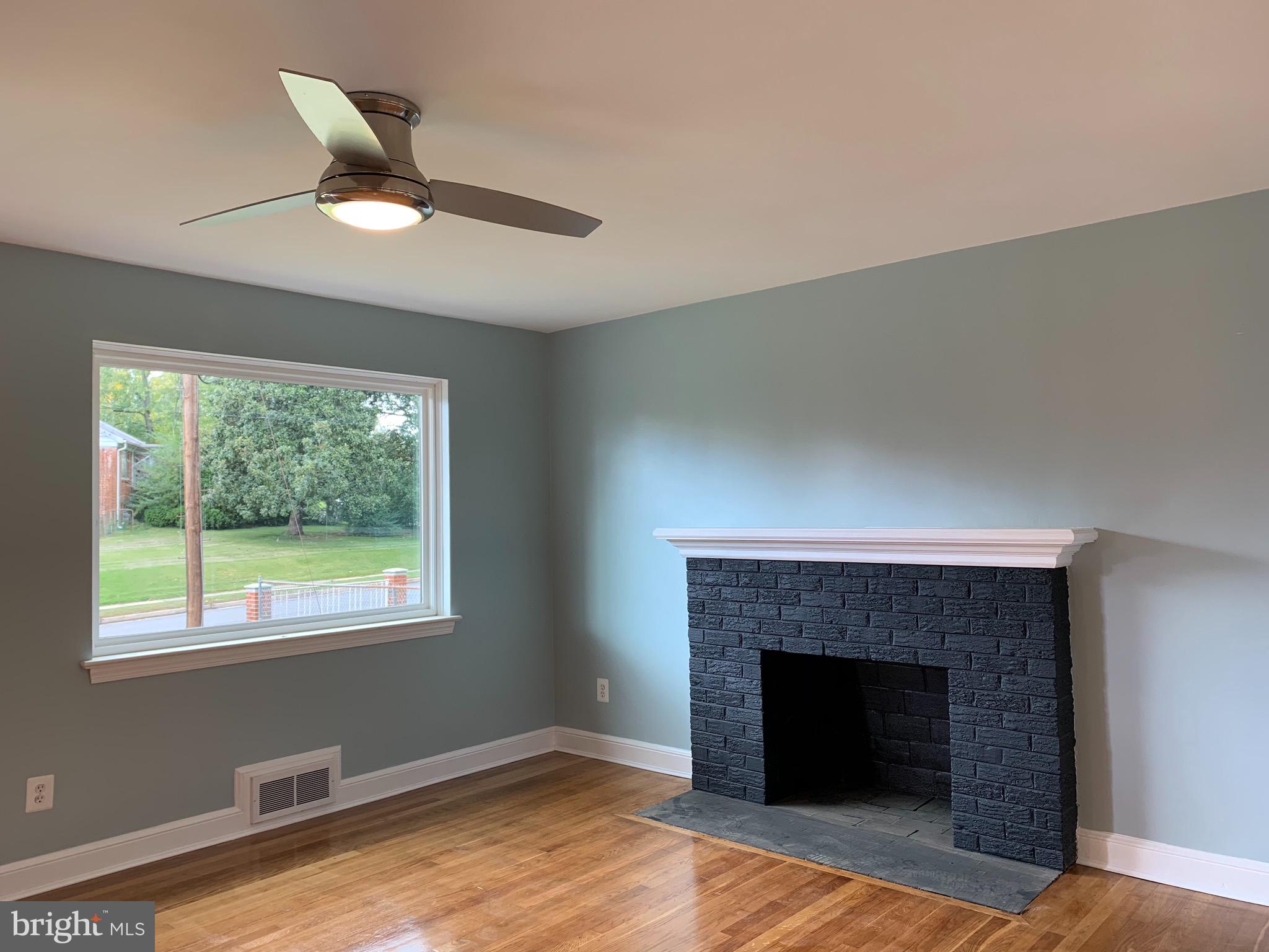 5819 Craig Street Springfield, VA 22150 - Photo 3 of 48 Formal Living Room with Wood Burning Fireplace.