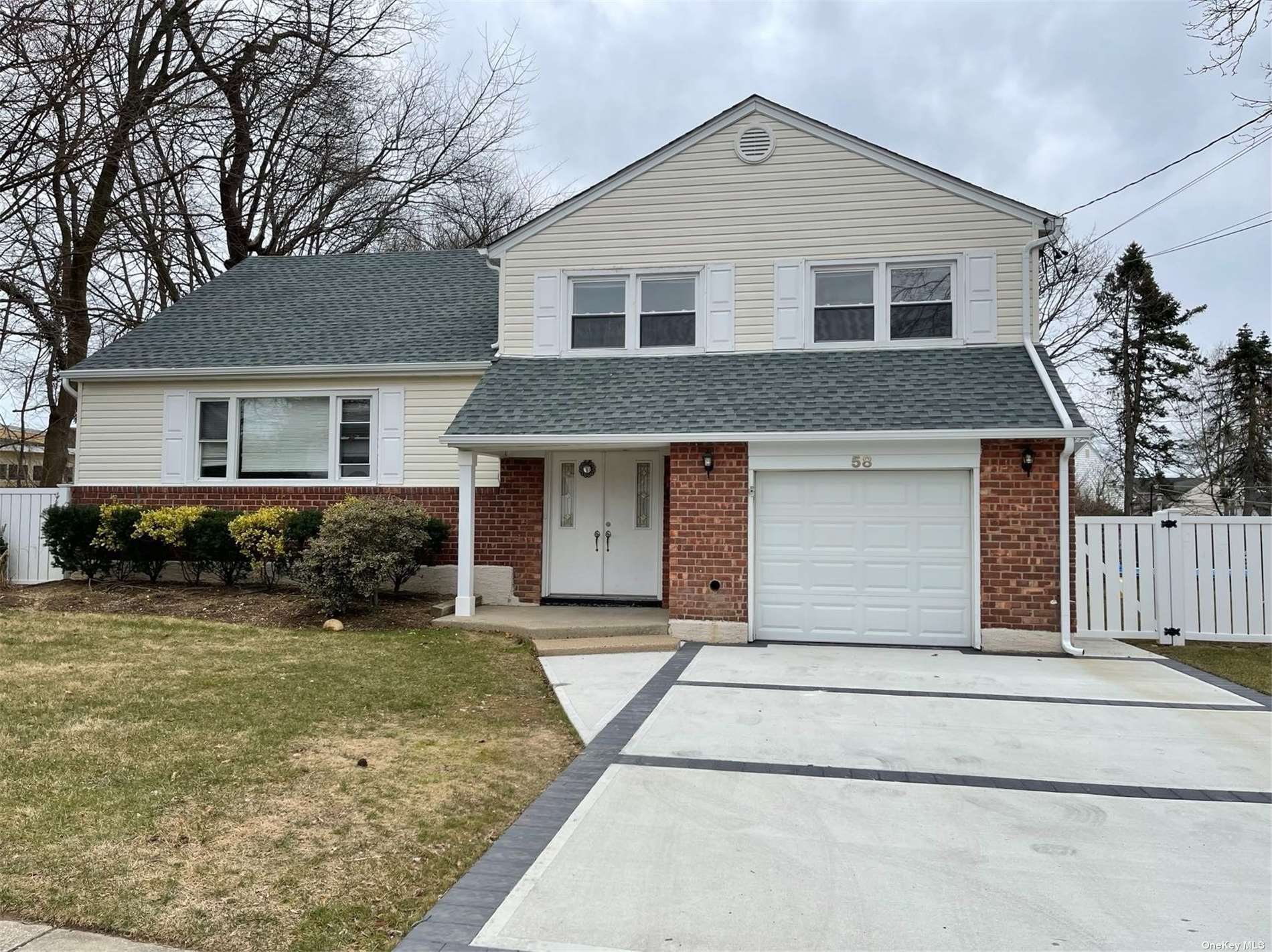 58 Convent Road Syosset, NY 11791 - Photo 1 of 1 a front view of a house with yard