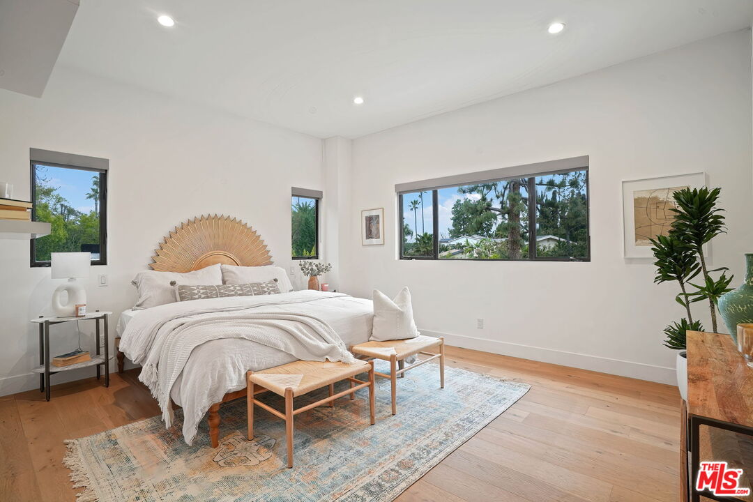 3056 Arrowhead Drive Los Angeles, CA 90068 - Photo 18 of 35 a bedroom with a bed wooden floor and window