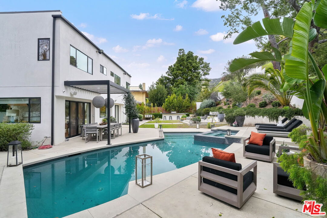 3056 Arrowhead Drive Los Angeles, CA 90068 - Photo 23 of 35 a view of swimming pool with outdoor seating and plants