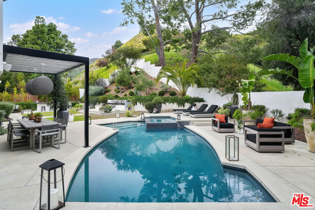 3056 Arrowhead Drive Los Angeles, CA 90068 - Photo 26 of 35 a view of a swimming pool with outdoor seating