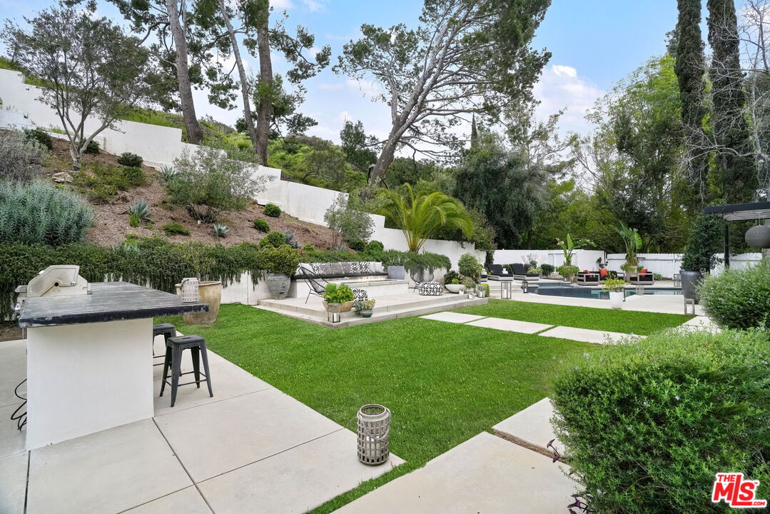 3056 Arrowhead Drive Los Angeles, CA 90068 - Photo 27 of 35 a swimming pool with outdoor seating and yard
