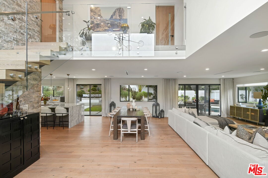 3056 Arrowhead Drive Los Angeles, CA 90068 - Photo 3 of 35 a view of a dining room with furniture window and wooden floor