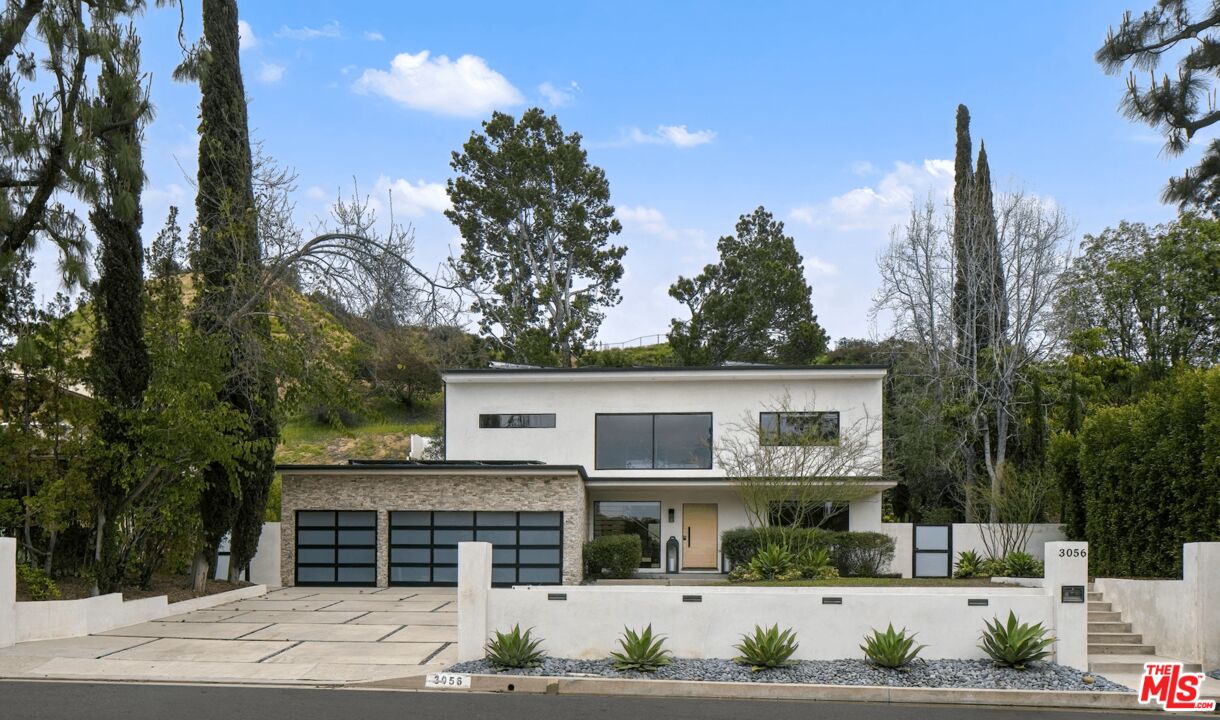3056 Arrowhead Drive Los Angeles, CA 90068 - Photo 31 of 35 a view of a house with a yard and potted plants