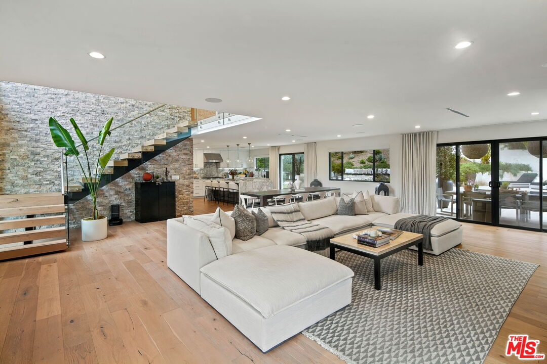 3056 Arrowhead Drive Los Angeles, CA 90068 - Photo 5 of 35 a living room with furniture a fireplace and a potted plant