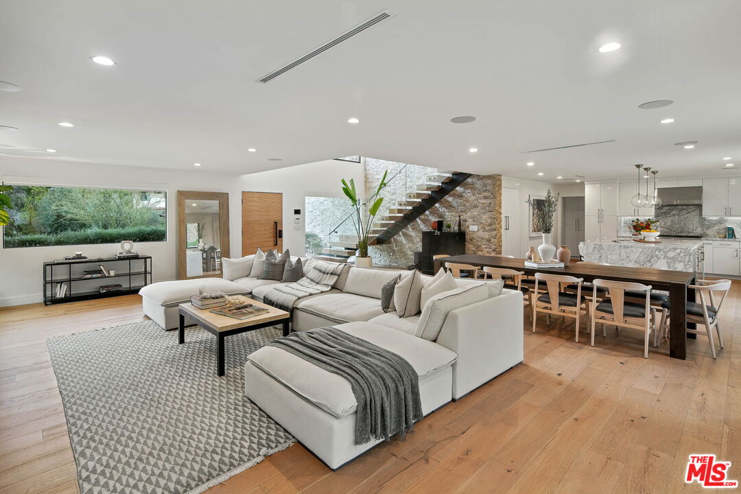 3056 Arrowhead Drive Los Angeles, CA 90068 - Photo 6 of 35 a living room with lots of furniture and kitchen view