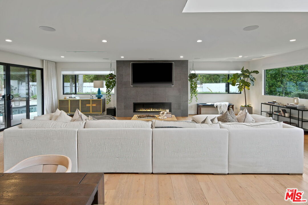 3056 Arrowhead Drive Los Angeles, CA 90068 - Photo 7 of 35 a living room with furniture fireplace and flat screen tv