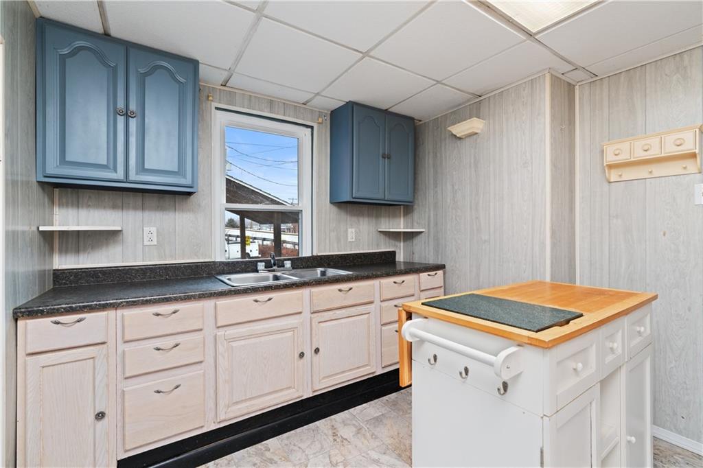 321 2nd Street Freeport, PA 16229 - Photo 14 of 24 a kitchen with granite countertop white cabinets and white appliances