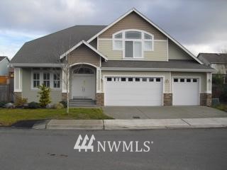 412 Kitsap Avenue Northeast Renton, WA 98059 - Photo 1 of 1 a front view of a house with a garden and garage