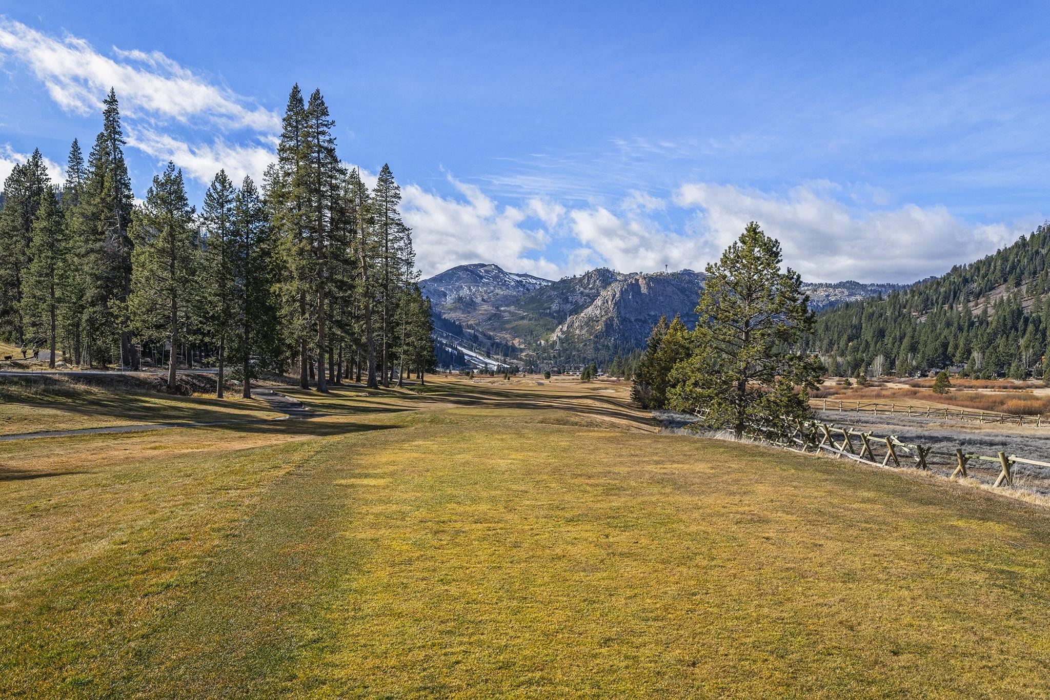 202 Hidden Lake Loop Olympic Valley, CA 96146 - Photo 14 of 28 a view of a pool with a house in the background