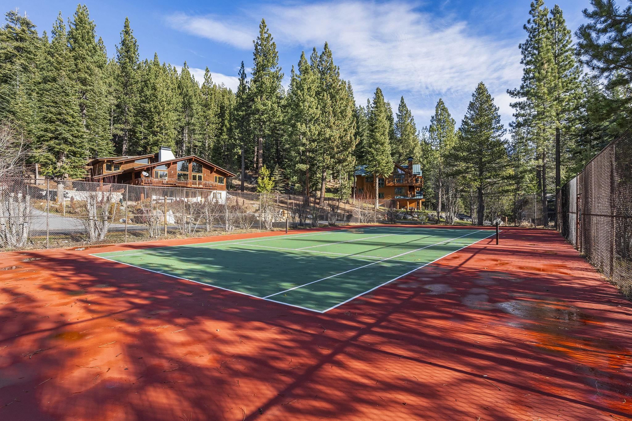 202 Hidden Lake Loop Olympic Valley, CA 96146 - Photo 7 of 28 a view of a tennis ground with large trees