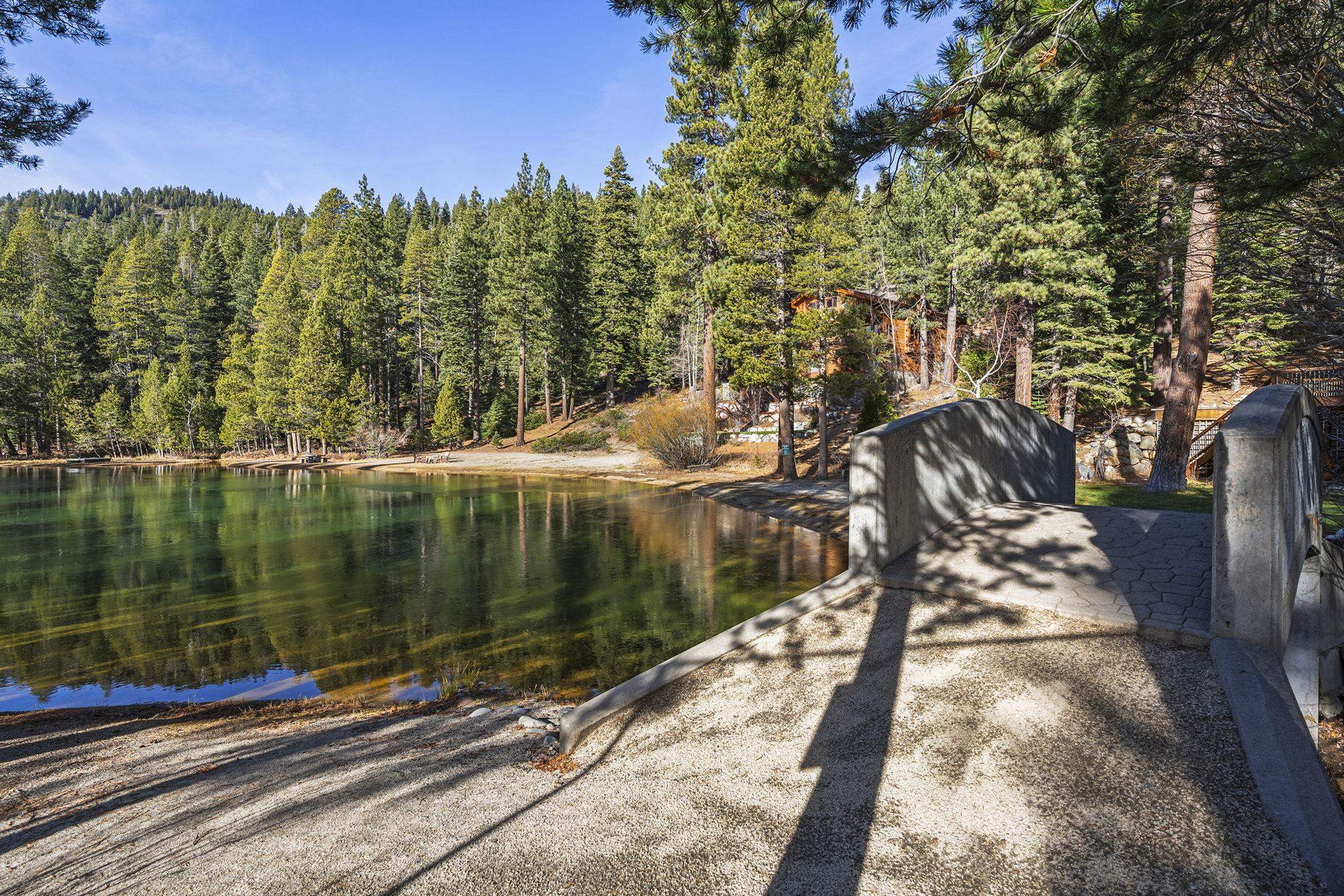 202 Hidden Lake Loop Olympic Valley, CA 96146 - Photo 9 of 28 a view of swimming pool from a lake
