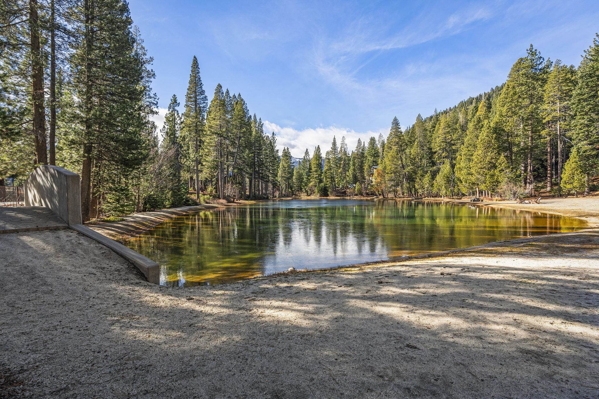 202 Hidden Lake Loop Olympic Valley, CA 96146 - Photo 10 of 28 a view of a lake with houses in the background