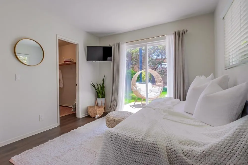 303-305 Sanford Street Encinitas, CA 92024 - Photo 16 of 41 a bedroom with a large bed and a window