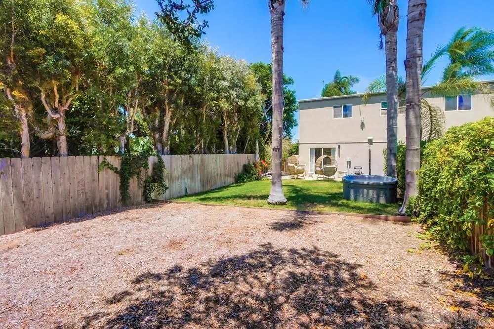 303-305 Sanford Street Encinitas, CA 92024 - Photo 22 of 41 a view of a backyard with a tree
