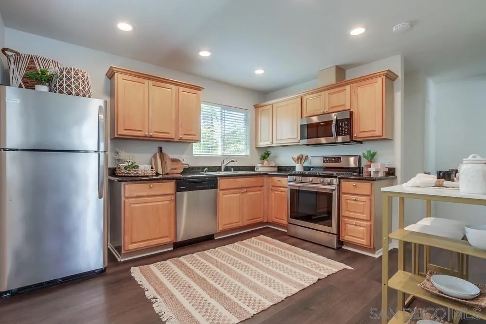 303-305 Sanford Street Encinitas, CA 92024 - Photo 28 of 41 a kitchen with a refrigerator stove top oven and sink
