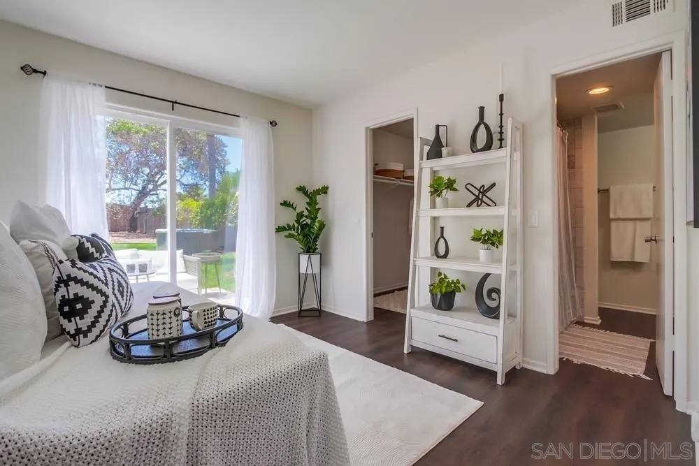 303-305 Sanford Street Encinitas, CA 92024 - Photo 33 of 41 a bedroom with furniture and a window