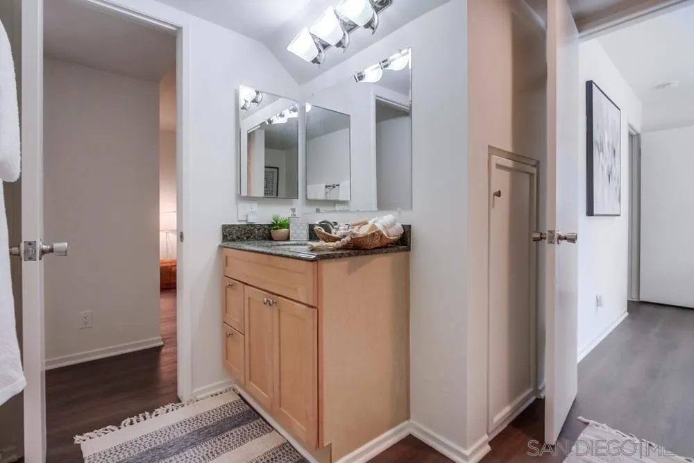 303-305 Sanford Street Encinitas, CA 92024 - Photo 35 of 41 a bathroom with a sink and a mirror
