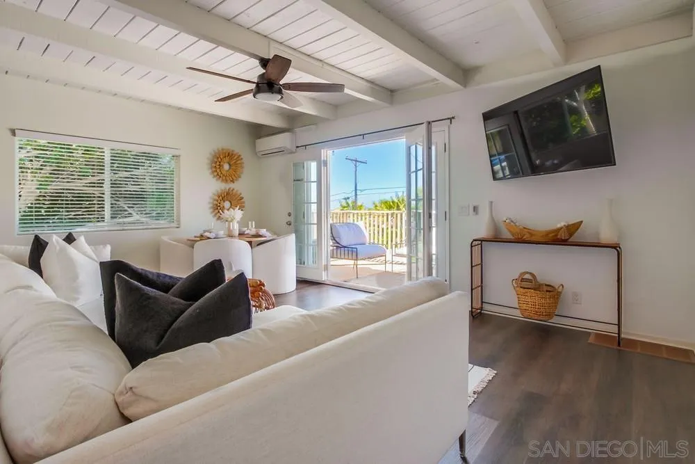 303-305 Sanford Street Encinitas, CA 92024 - Photo 4 of 41 a living room with furniture and a flat screen tv