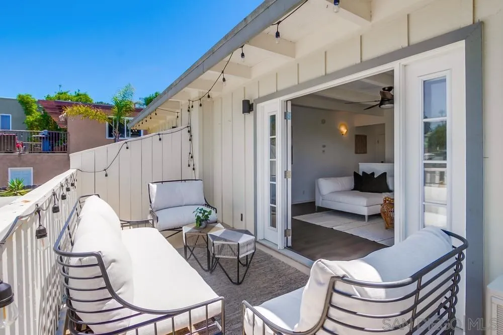 303-305 Sanford Street Encinitas, CA 92024 - Photo 9 of 41 a balcony with table and chairs