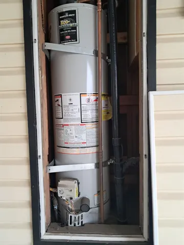 a close view of a utility room with washer and dryer