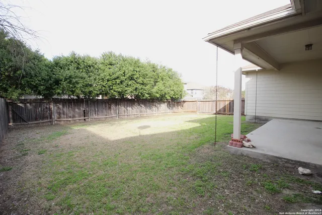 a view of a backyard with green space