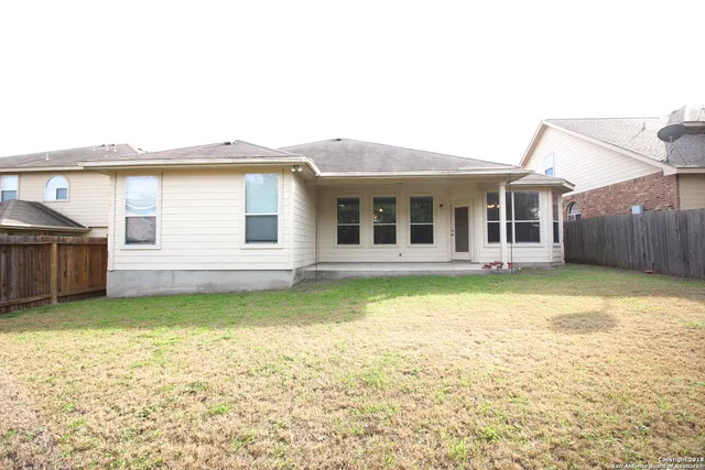 a view of a house with a garden and deck