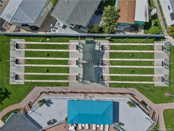 an aerial view of a house with a garden and plants