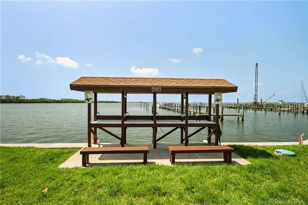 a view of a swimming pool with outdoor seating
