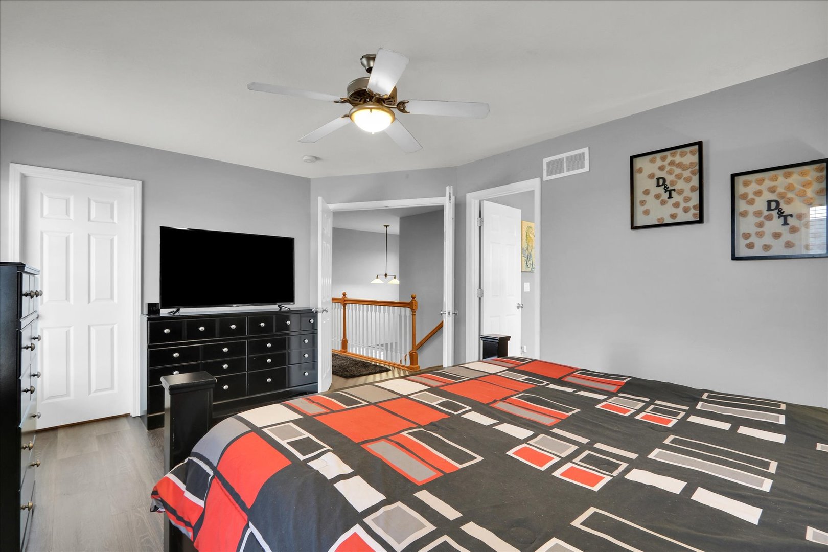 3808 Pebblebrook Lane Champaign, IL 61822 - Photo 19 of 31 a bedroom with a bed and a flat screen tv