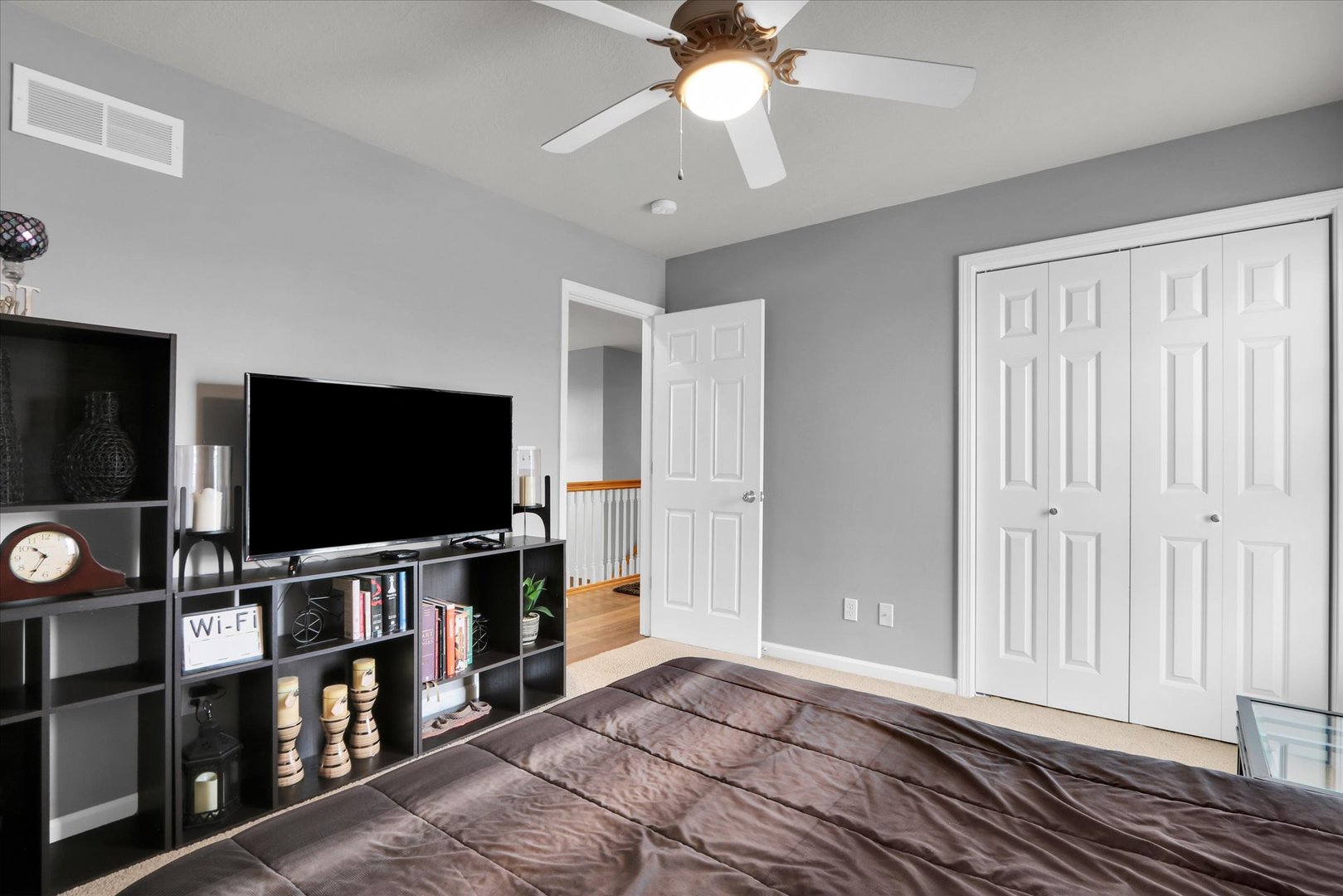 3808 Pebblebrook Lane Champaign, IL 61822 - Photo 25 of 31 a bedroom with furniture and a flat screen tv