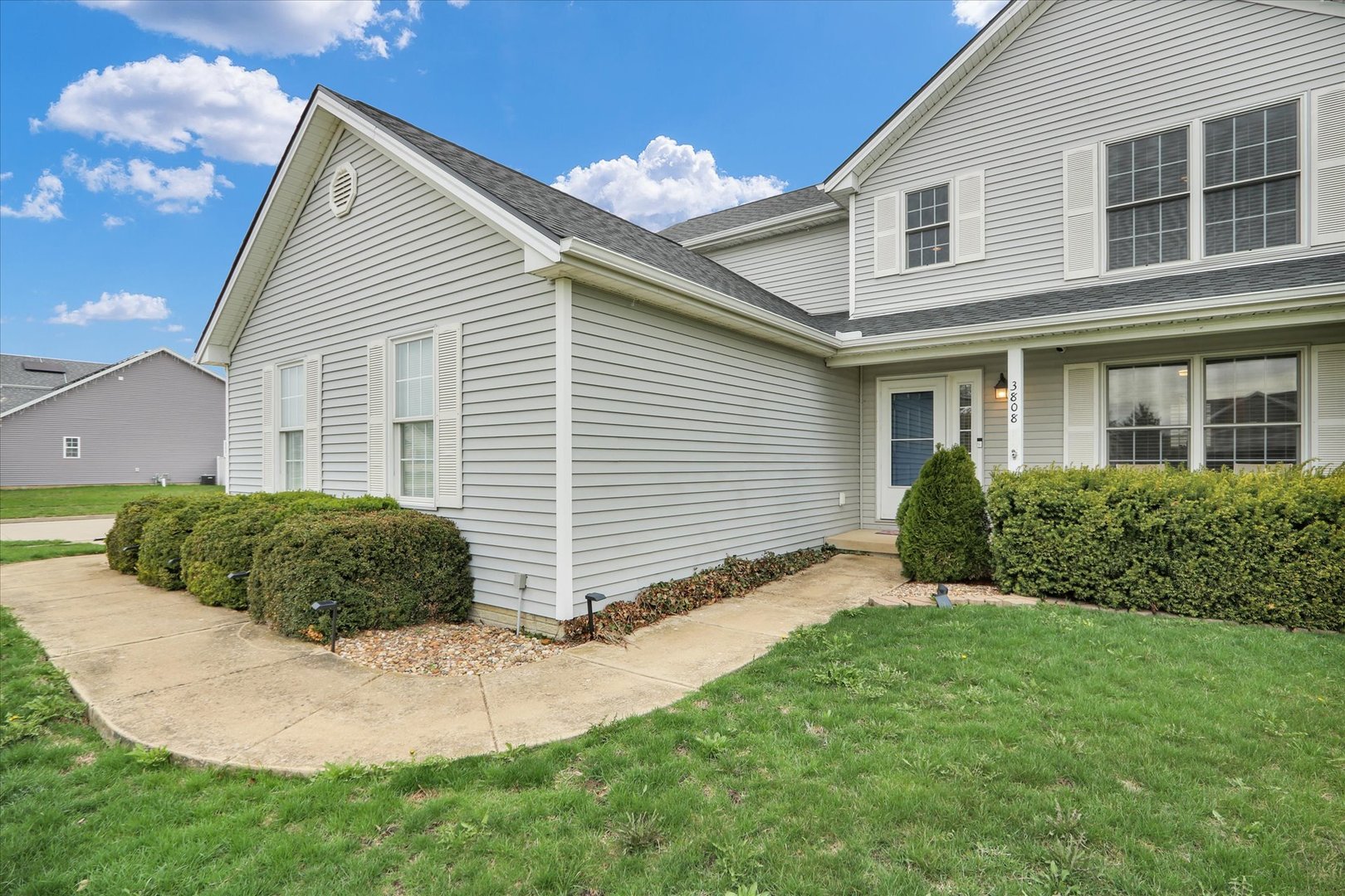 3808 Pebblebrook Lane Champaign, IL 61822 - Photo 3 of 31 a view of a house with a yard and a garden