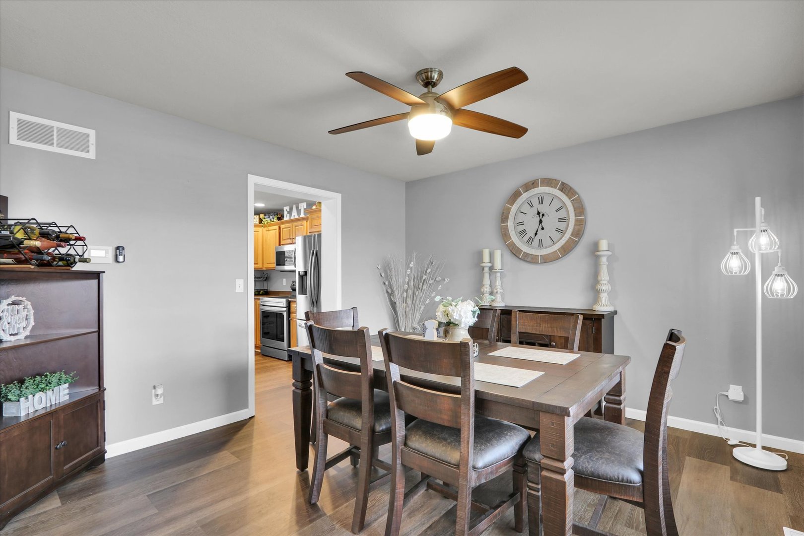 3808 Pebblebrook Lane Champaign, IL 61822 - Photo 5 of 31 a view of a dining room with furniture and a chandelier fan