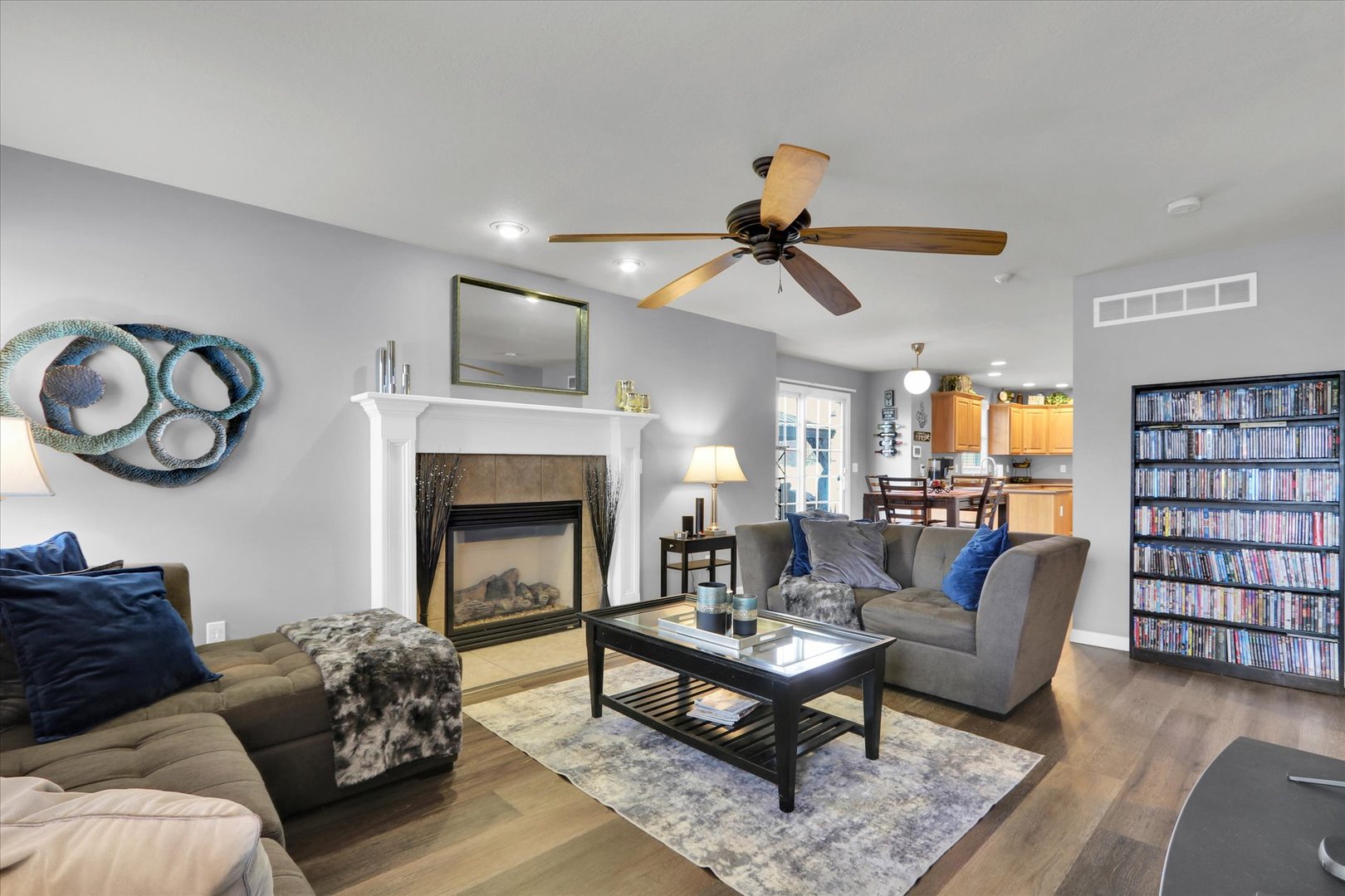 3808 Pebblebrook Lane Champaign, IL 61822 - Photo 8 of 31 a living room with furniture a rug and a fireplace