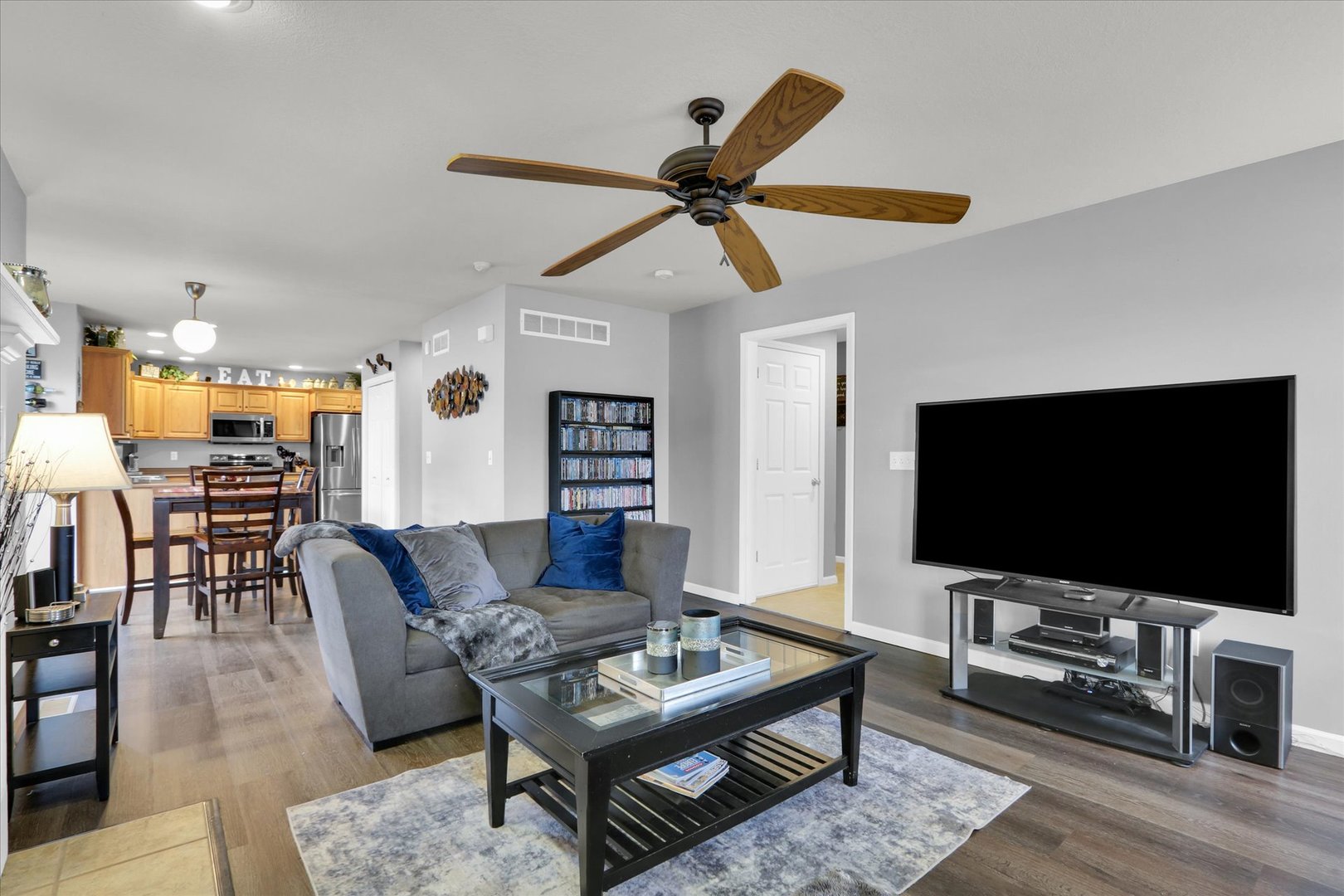 3808 Pebblebrook Lane Champaign, IL 61822 - Photo 9 of 31 a living room with furniture and a flat screen tv