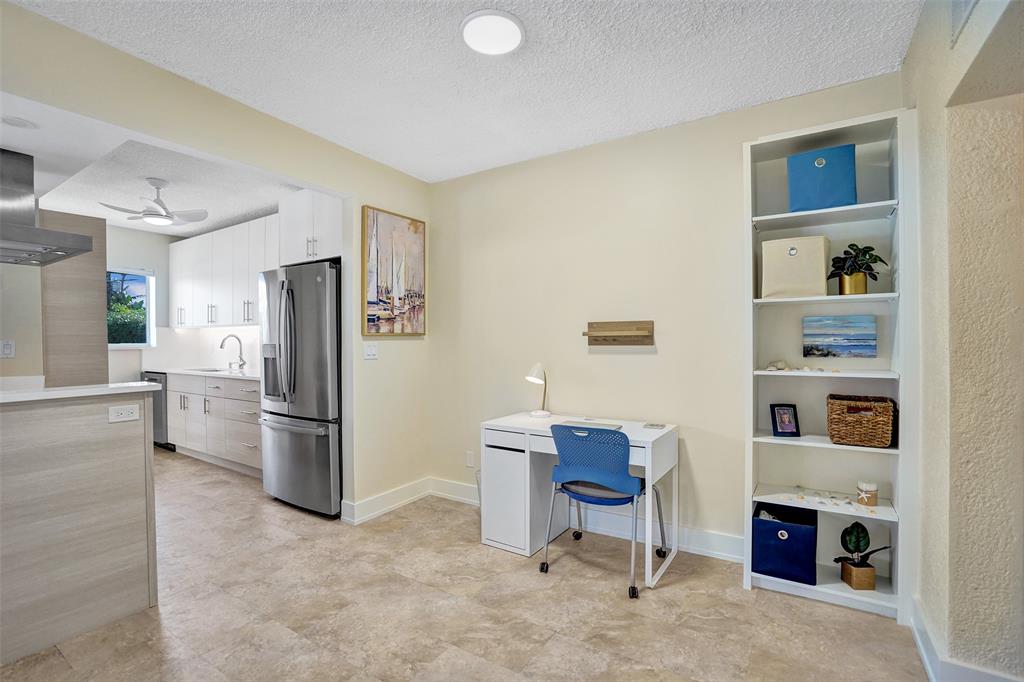5700 Old Ocean Boulevard, Unit X Ocean Ridge, FL 33435 - Photo 16 of 49 a kitchen with stainless steel appliances a refrigerator and a cabinets